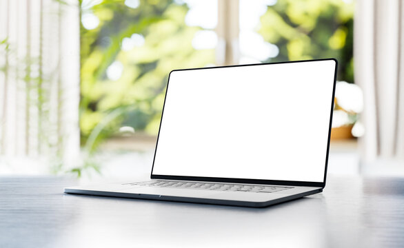 Laptop with a blank frameless screen on the table, angled position - 3d render