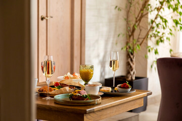 breakfast table with a variety of dishes and drinks