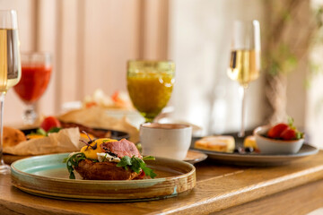 breakfast table with a variety of dishes and drinks