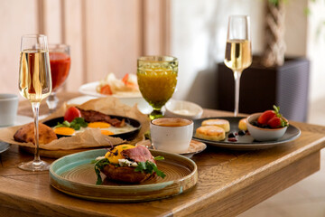 breakfast table with a variety of dishes and drinks