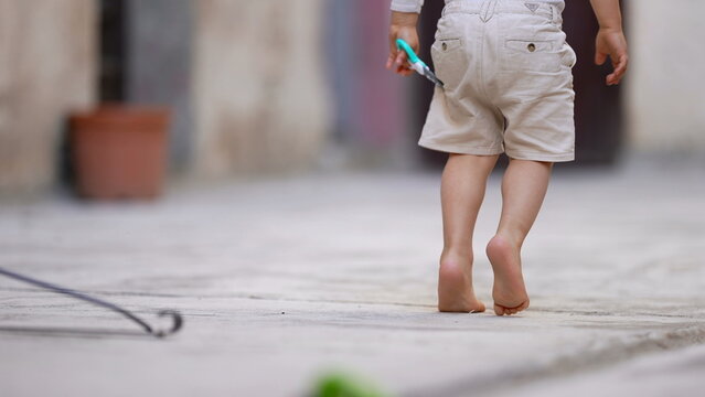 Young child walking on tiptoes clearance