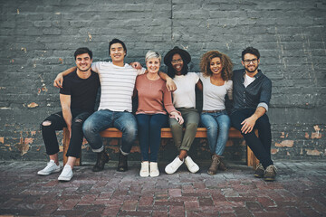 Fototapeta premium We there for each other. Shot of a diverse group of people chilling together outside.