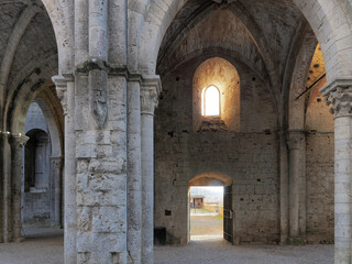 Fototapeta na wymiar San Galgano, Chiusdino (SI), Italy - February 12, 2022: Ruins of the former Cistercian abbey Abbazia San Galgano, Chiusdino, Siena, Tuscany, Italy