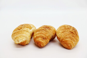 Small croissants on a white table