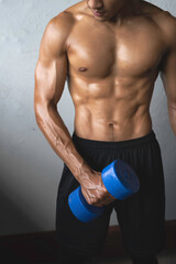 Naklejka premium Young man with fit and firm muscle