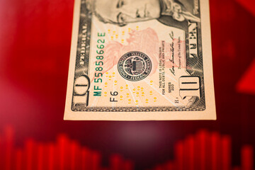 Fototapeta premium US dollar currency laundering and red stock market chart concept. Illegal and crime corruption background photo