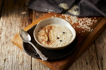 Arroz con leche with cinnamon, a typical Ecuadorian dessert served on a traditional plate on a...