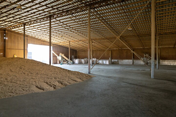 Piles of wheat grains at mill storage or grain elevator. The main commodity group in the food markets.