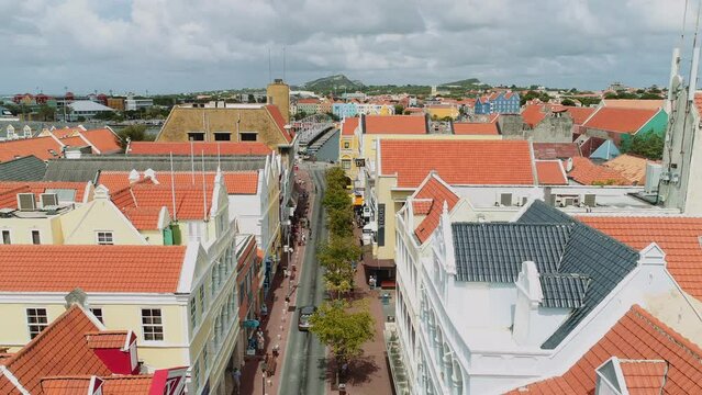 Willemstad is the capital city of Curaçao, a Dutch Caribbean island. aerial view  features brightly painted colonial buildings and colorful roofs