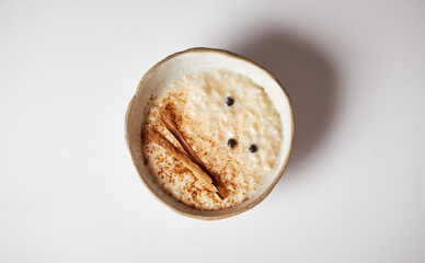 Arroz con leche with cinnamon, a typical Ecuadorian dessert served on a traditional plate on a...