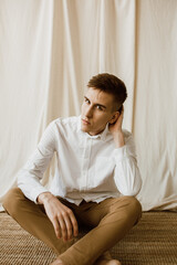 Fototapeta premium man sitting on the floor
