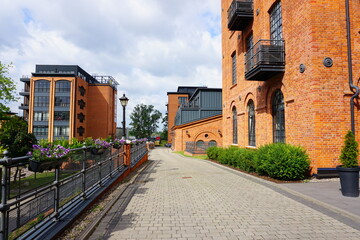 A combination of tradition and modernity. A red-brick residential and hotel complex - details of the architecture of the city of Lodz
