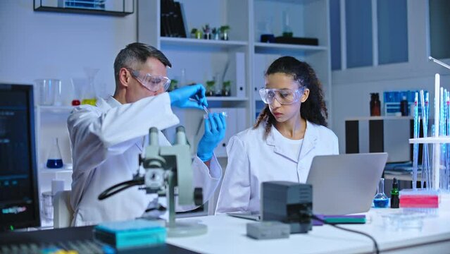 Scientists Checking Cultured Meat Sample In Food Quality Control Laboratory