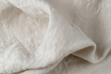 Obraz premium Creased light white grey color natural linen fabric as background