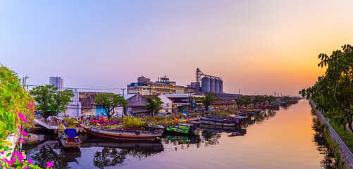 Springtime in Saigon, boat on canal, transport spring flower for Tet to Ben Binh Dong open air...