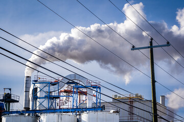 A local craft distillery emitting steam vapour from an exhaust vent with foreground transmission...