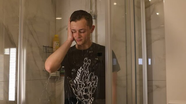 Depressed teenager in the shower thinking about life