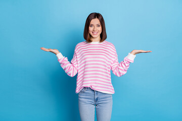 Photo of optimistic bob hairstyle young lady hold promo wear pink shirt jeans isolated on blue color background