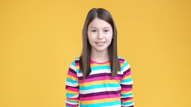 Sweet kid girl cover mouth gossip privacy isolated shine color background