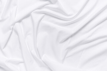 White fabric texture background. Cloth soft wave. Creases of satin, silk, and cotton.