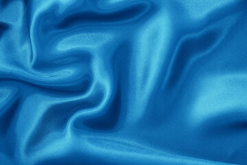 Blue fabric cloth texture for background and design art work, beautiful crumpled pattern of silk or linen.