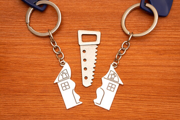 Fototapeta na wymiar Matching split house keychains with a small saw