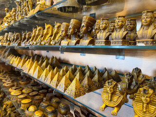 Figurines of Pharaohs, pyramids and sphinxes in souvenir shop in Hurghada, as travel concept....