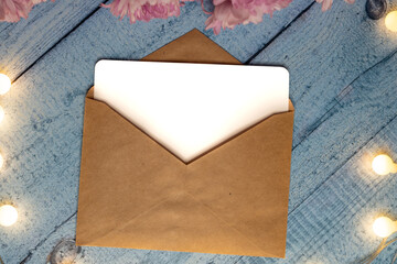 postcard envelope wooden table and chrysanthemums