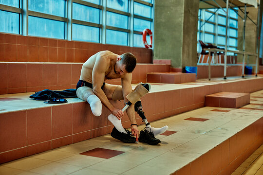 Disabled swimmer getting ready for training - Powered by Adobe