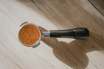 top view of holder filling with ground coffee