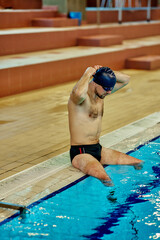 Male swimmer preparing for swimming