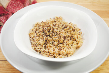 A Side Dish of Steamed Quinoa and Brown Rice in a White Bowl