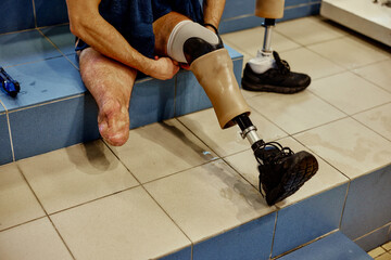 Man setting prosthetic leg after training