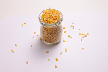 Deep fried crunchy spicy lentils moong dal fry in small glass jar