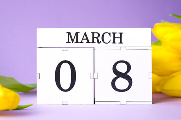 spring holidays concept. closeup of 8 march date on wooden calendar