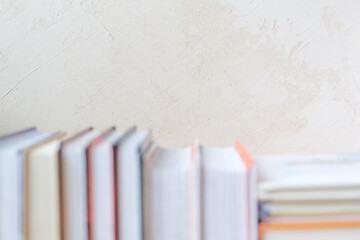 Book stack blurred bookshelf in the room for business and education background, back to school concept. Copy space
