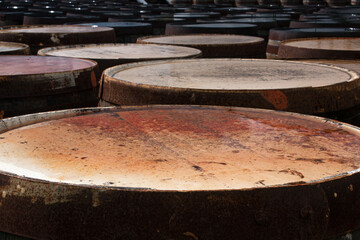 Loads of whisky barrels in a distillery in Scotland, waiting to be filled