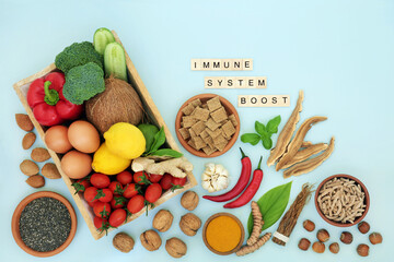 Health food for immune system boost with vegetables, fruit and medicinal herbs and spice. Health food high in antioxidants, anthocyanins, lycopene, fibre, omega 3, protein, vitamins and minerals.  