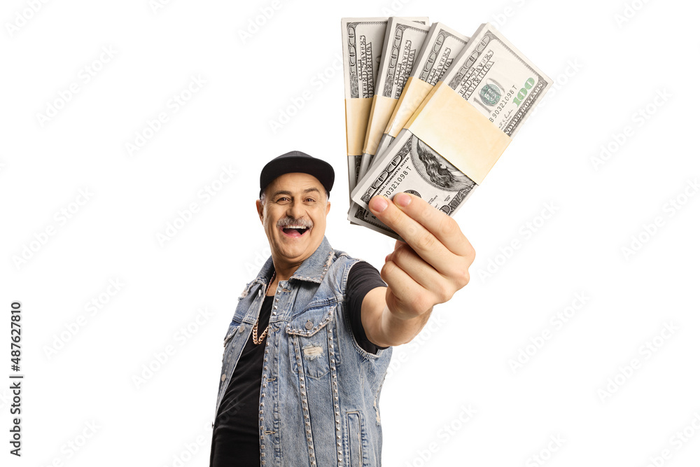 Wall mural Happy mature man in a denim vest holding money