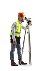 Full length profile shot of a geodetic surveyor working with a measuring equipment