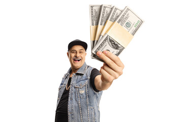 Happy mature man in a denim vest holding money