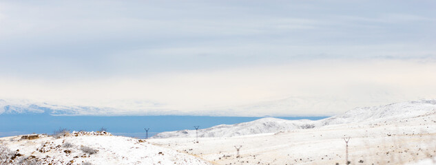 Fototapeta na wymiar Snow covered mountain peak winter panorama landscape
