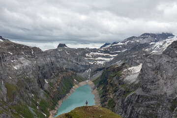 Amazing shot of a beautiful landscape in the alps of Switzerland. Wonderful flight with a drone over an amazing landscape in the canton of Glarus. Epic view over a lake called Limmerensee.