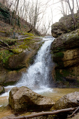 Natural riverbed and waterfalls on a mountain river, autumn in a natural park, walking in picturesque places..-.