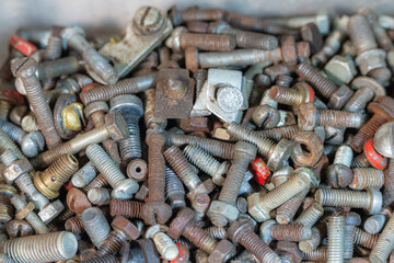 Various size old bolts in wooden boxes.