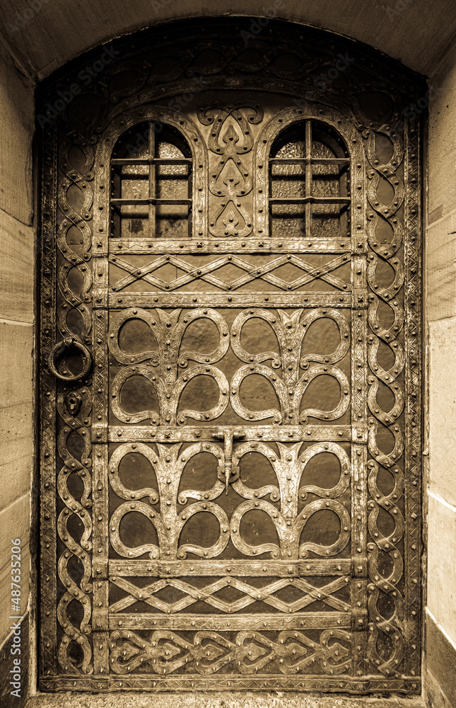 Wall mural old wooden door at a historic building