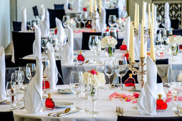 table with silverware and glasses at a restaurant