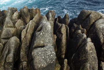 Rocky coastline with ocean in background