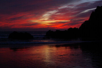 Sunset on rocky coastline