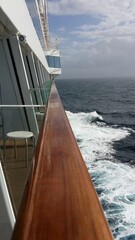 View down handrail of cruise ship at sea